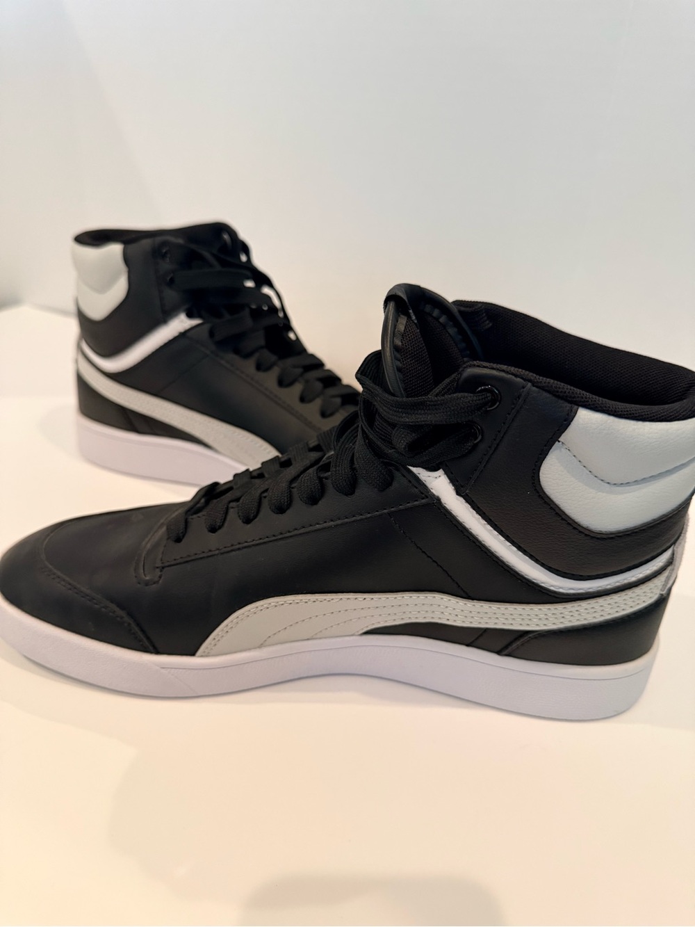Puma Black and White Mid-Top Sneakers with Gold Logo